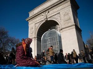 NEW YORK, NY - JAN. 26: Muslims pray following a protest to the mark the one year anniversary of the Trump administration's executive order banning travel into the United States from several Muslim majority countries, in Washington Square Park, New York City. (Drew Angerer/Getty Images/AFP) 
