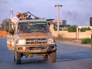 Forces loyal to the Government of National Accord patrol a street during renewed clashes in the south of the Libyan capital Tripoli. (AFP)