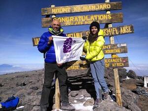 Mountaineers Mostafa Salameh and Farah Raed Abu Baker raise the Jordan Alzheimer’s Association banner on top of Mount Kilimanjaro in April 2017 (Photo courtesy of the JAA)