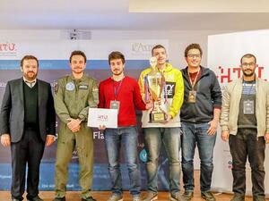 Crown Prince Hussein poses for a photo with the winners of Al Hussein Technical University cybersecurity Hackathon competition, on Wednesday (Petra Photo)