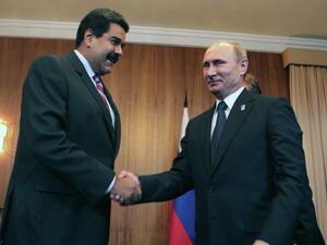 Venezuelan President Nicolas Maduro and his Russian counterpart Vladimir Putin shake hands in this 2015 photo. (AFP)