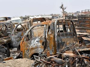 This picture taken on March 24, 2019 shows destroyed vehicles in the village of Baghouz in Syria's eastern Deir Ezzor province near the Iraqi border, a day after the Islamic State group's 'caliphate' was declared defeated by the US-backed Kurdish-led Syrian Democratic Forces (AFP)