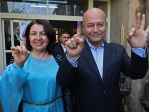 Barham Salih and his wife, during the May election. Salih has been nominated by the PUK to be the next president of Iraq. (AFP/File)
