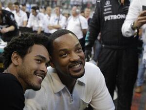Will Smith and his son Trey visit the pit lane during the Abu Dhabi Formula One Grand Prix. (Source: AFP)
