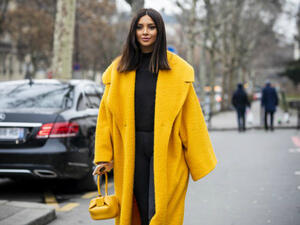 Nathalie stepped out this week wearing an oversized yellow coat over an all-black outfit (Source: nathaliefanj - Instagram)