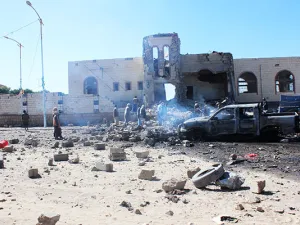 People inspect damage at the site of air strikes (AFP/File Photo)