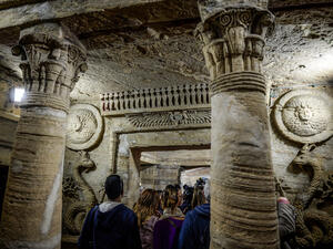 Visitors tour through the catacombs of Kom El-Shoqafa (Mound of Shards), dating to the Roman period (1st-4th centuries AD) in the centre of the Egyptian Mediterranean coastal city of Alexandria on March 3, 2019. (AFP/ File)