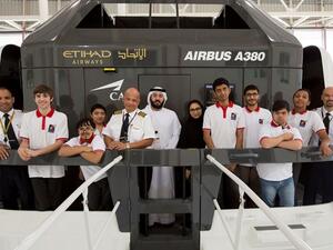 A student learns from an Etihad Airways captain about adjusting to altitude and weather conditions in the air.