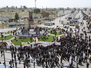 People gather at Arab Army Square in Zarqa (Facebook)