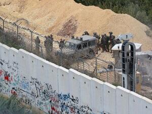 Israeli soldiers gathering near an Israeli excavation site for reported cross-border Hezbollah-dug tunnels (AFP /Mahmoud ZAYYAT)