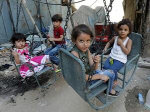 Syrian refugee children in Lebanon in a makeshift playground (AFP/File Photo)	