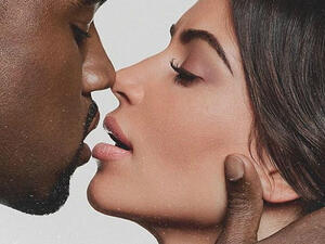 Smooch: Kim Kardashian is proving the love is still alive with husband Kanye West. On Saturday the reality TV star, 37, shared an intimate photo to Instagram where she was kissing the rapper (Source: Kim Kardashian - Instagram)