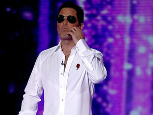 Twinning: Robbie Williams bared a scarily similar resemblance to Simon Cowell on Saturday night as he transformed into the music mogul for the Halloween episode of X Factor (Dymond Thames - Syco - REX - Shutterstock)