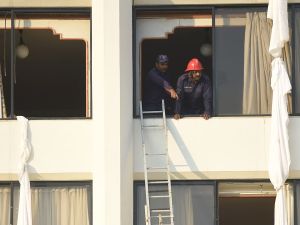 Man looking out the window (AFP/File Photo)