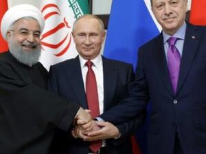 Best of Friends: Rouhani, (L), Putin (C) and Erdogan prepare to talk politics on Syria in Ankara meeting, Wednesday  (AFP/File Photo)	
