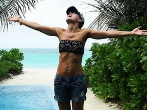 Breaktime: Emma Willis, 42, took a well deserved 'family moon' to the Maldives as she showed of her enviably trimmed body in a tiny bikini top and shorts (Source: emmawillisofficial - Instagram)