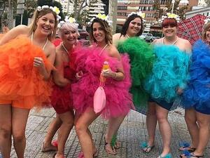 Six friends show off their colourful outfits. The event takes place annually, a day after the official Benidorm fiesta ends (dailymail)