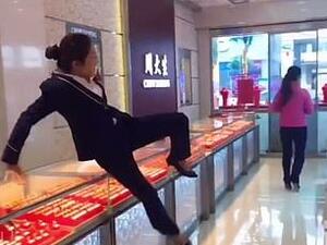 As bewildered shop assistants leap over the counter and give chase, the practical jokers stop short of the door to admire themselves in front of a mirror, leaving the employees red-faced (Facebook)