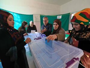 A Syrian woman casts her vote in local elections held in the Kurdish-dominated northern city of Qamishli (AFP/Delil souleiman)
