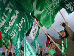 Hamas supporters wave flags during a rally in Gaza. (AFP/File)