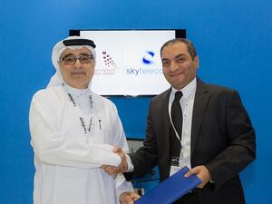 From left to right: Mohammed Qasim Al-Ali, CEO of National Bonds, and Mohamed Hashem, General Manager of Sky Telecom Group
