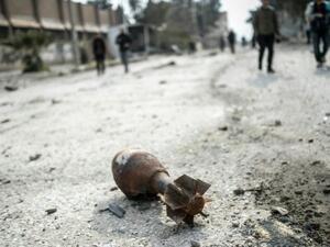 A mortar shell sits in the center of the Syrian border town of Kobane, known as Ain al-Arab, on January 28, 2015. (AFP/File)