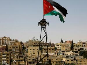 A Jordanian flag flutters above the Jordanian capital Amman. (AFP)