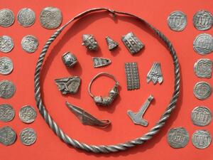 Braided necklaces, pearls, brooches, a Thor's hammer, rings and up to 600 chipped coins were found on the German island of Ruegen in the Baltic Sea (AFP/File Photo)	