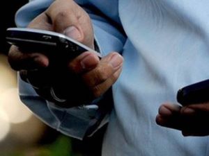 A man checking his phone (AFP/File Photo)	