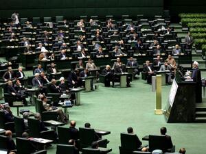 Iranian President Hassan Rouhani (R) delivers a speech to parliament before presenting the proposed annual budget in Tehran. (AFP/ File)