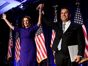 House Minority Leader Nancy Pelosi (D-CA) and Representative Ben Ray Lujan (D-MN), DCCC Chairman, celebrate a projected Democratic Party takeover of the House of Representatives during a midterm election night party hosted by the Democratic Congressional Campaign Committee on November 7, 2018 in Washington, DC. 
Brendan Smialowski / AFP