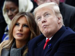 US First Lady Melania Trump (L) and US President Donald Trump (R) look on as they attend a ceremony at the Arc de Triomphe in Paris on November 11, 2018 as part of commemorations marking the 100th anniversary of the 11 November 1918 armistice, ending World War I. 
Francois Mori / POOL / AFP