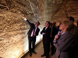 French President Emmanuel Macron (C) and his wife Brigitte (R), accompanied by Egyptian Minister of Antiquities Khaled el-Enany (L) visit the temple of Abu Simbel in southern Egypt  (AFP)