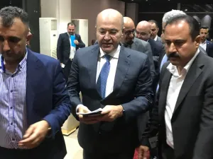 Iraq's newly elected president, Kurdish politician Barham Salih (C). (AFP/File)