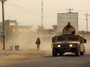Afghan security forces travel in a Humvee vehicle, as battles were ongoing between Taliban militants and Afghan security forces, in Kunduz, capital of northeastern Kunduz province. (AFP)  