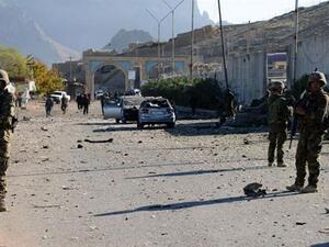 Afghan security forces gather at the site of a Taliban attack in Kandahar. (AFP)