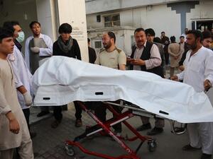 Afghan volunteers carry a dead body on a stretcher to a hospital following a suicide attack in Kabul on August 15, 2018. At least 37 people, the majority of them students, were killed when a suicide blast ripped through a school in a Shiite area of Kabul on August 15. (AFP/ File)

