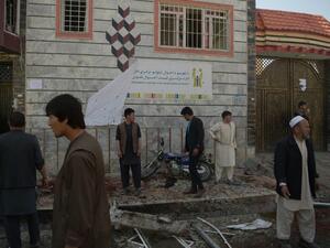 Residents inspect site of a suicide bombing outside the voter registration center. (AFP/ File Photo)