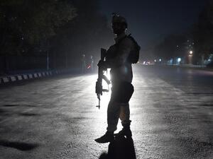 An Afghan security personnel walks as he keep watch near the site of an attack by gunmen inside the Kart-e- Sakhi shrine in Kabul on October 11, 2016. (AFP/Wakil Kohsar)