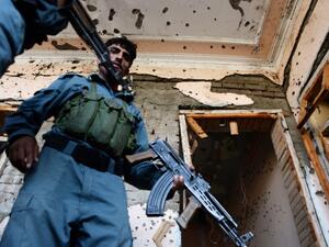 Afghan security forces inspect the site of a suicide bombing that targeted a gathering of the local tribal elders in Chaparhar district of Nangarhar province on October 31, 2016.(AFP/Noorullah Shirzada)