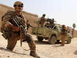 In this photograph taken on October 2, 2016, Afghan National Army commandos take position during a military operation in Helmand province. (AFP/Noor Mohammed)