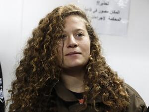 Sixteen-year-old Ahed al-Tamimi stands for a hearing in the military court (AFP/File Photo)	