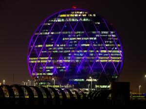 Aldar HQ building turns purple for NYUAD's fifth Commencement.