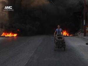Syrian kids burning tires in Aleppo to confuse warplanes (Twitter/@ShamiRebel/Aleppo Media Center)