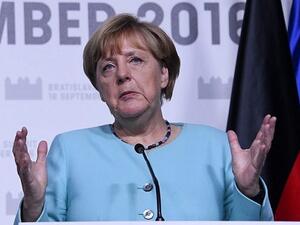 German Chancellor Angela Merkel delivers a joint statement with the French President after the European Union Summit of 27 heads of state or government. (AFP/File)