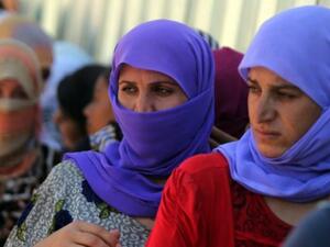 Yazidi Iraqi women queue in order to get food at the Bajid Kandala camp in Kurdistan's western Dohuk province (AFP/Ahmad Al Rubaye) 