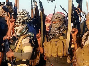 ISIS fighters celebrating in Tikrit, Iraq, last month. (AFP/File)  