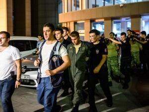 Turkish anti-riot police escort soldiers who allegedly took part in a military coup, as they leave a courthouse in Istanbul on July 16, 2016. (AFP/Ozan Kose)