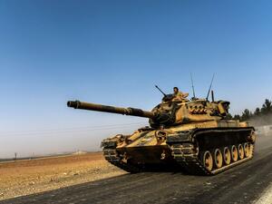 A Turkish army tank in the border city of Karkamis drives towards Syria. (AFP/Bulent Kilic)