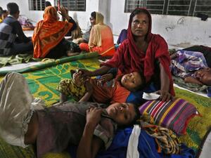 Bangladeshi villagers take refuge in a cyclone shelter following an evacuation by authorities in the coastal villages of the Cox's Bazar district on May 29, 2017 as Cyclone 'Mora' gradually approaches towards the coastline. (AFP/Stringer)